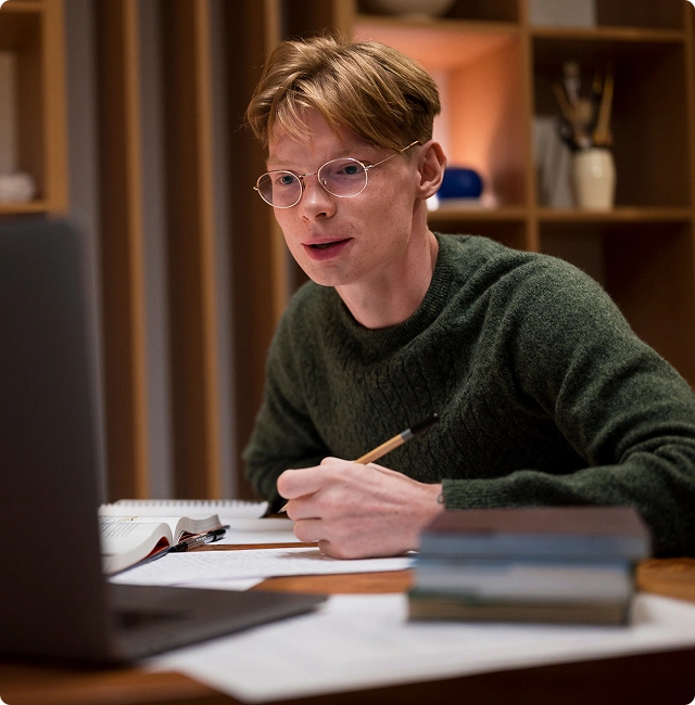 guy studying in front of the laptop