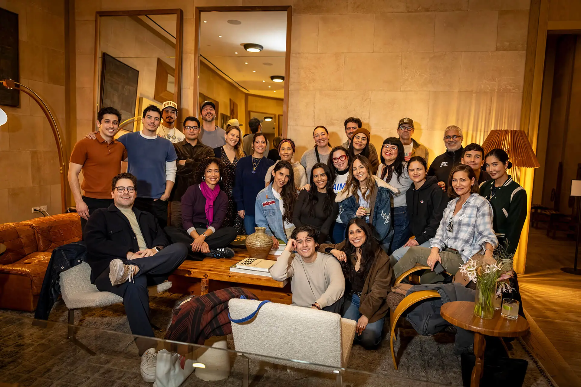 Good People team members Kevin Rutkowski and Else Collins in group photo with celebrities and volunteers for Flamin Hot Cultural Campaign in upscale hotel lobby setting