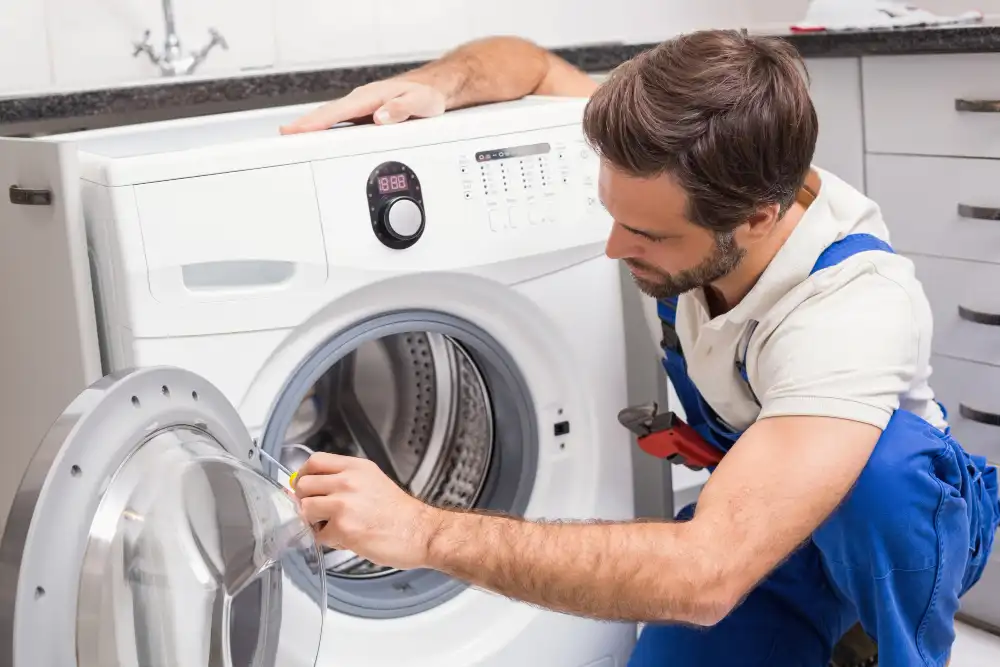 technician repairing washer