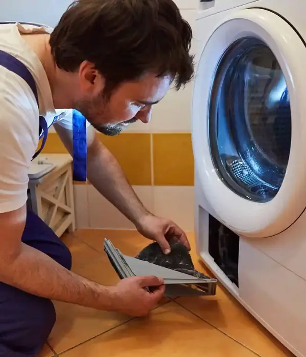 Technician fixing a dryer in Mira Mesa