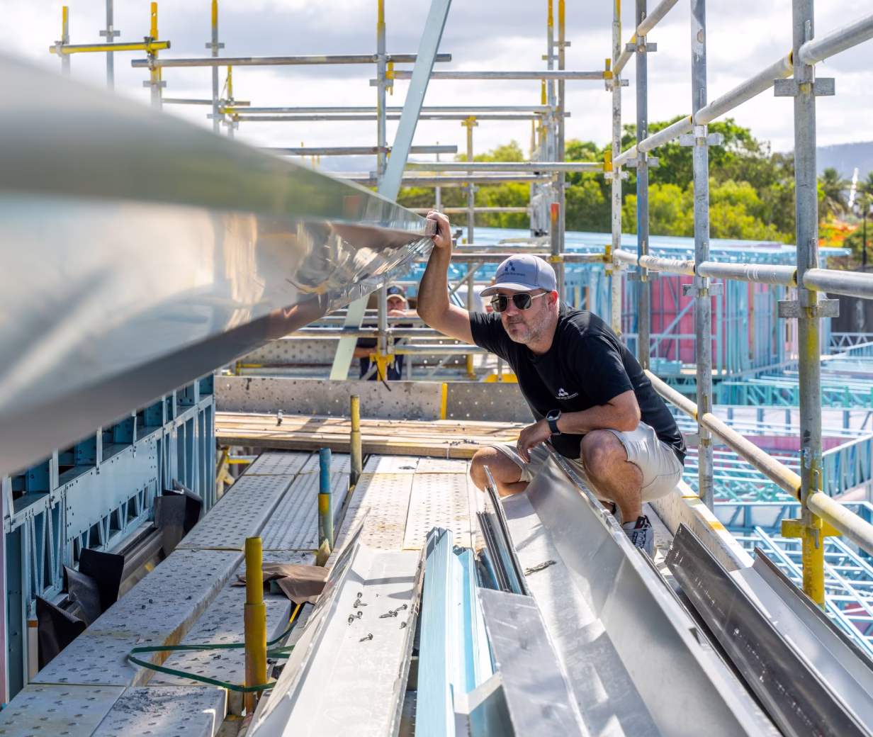 a man working on a metal structure