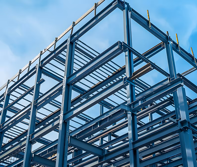 Close-up view of a blue steel frame structure under construction against a blue sky.