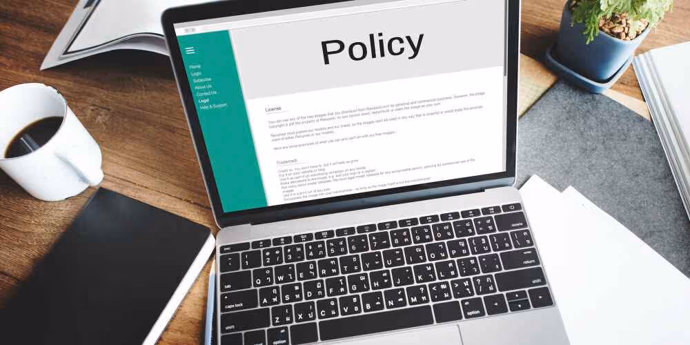 Policy page on laptop I-485 Beyond Border