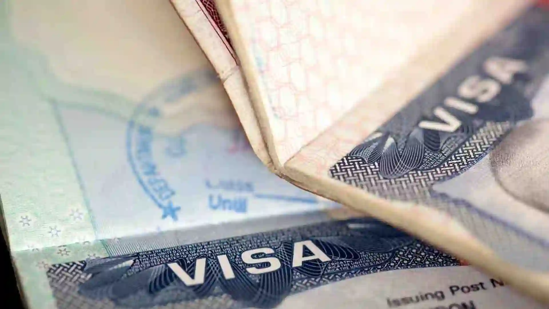Visa stamp in passport immigration firm Beyond Border