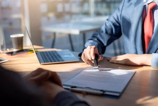 Professional stamping document at office desk Beyond Border