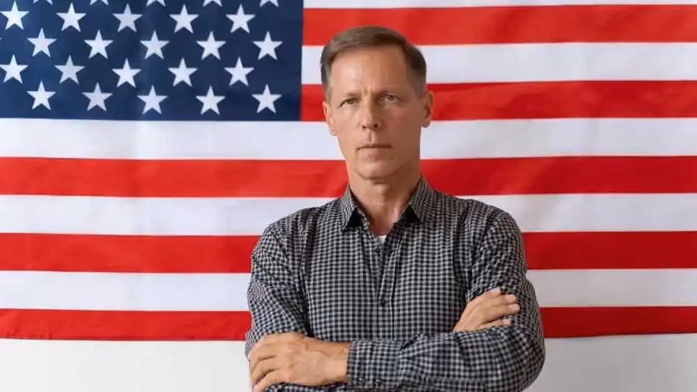 U.S. flag background with a man posing Beyond Border
