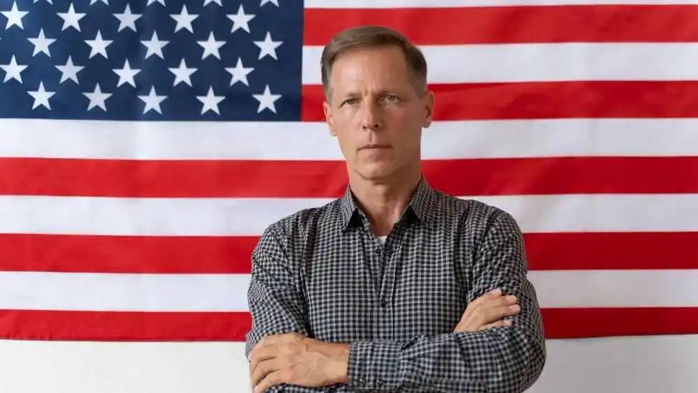 U.S. flag background with a man posing Beyond Border