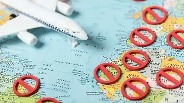 Travel restrictions map with airplane and blocked countries Beyond Border