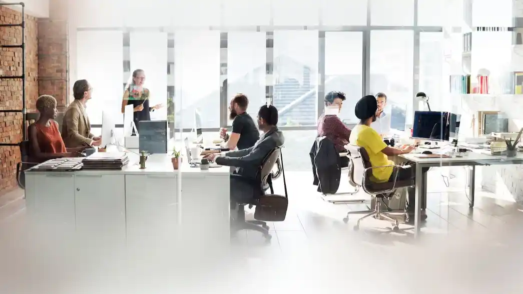 Team working in bright open office space Beyond Border