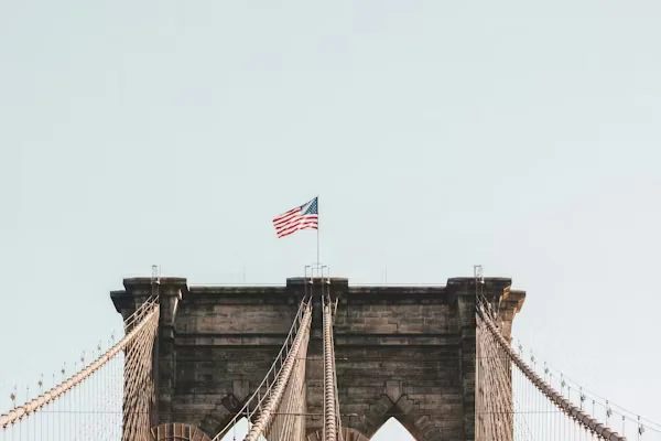 The U.S. flag flying atop the Brooklyn Bridge. Beyond Border.
