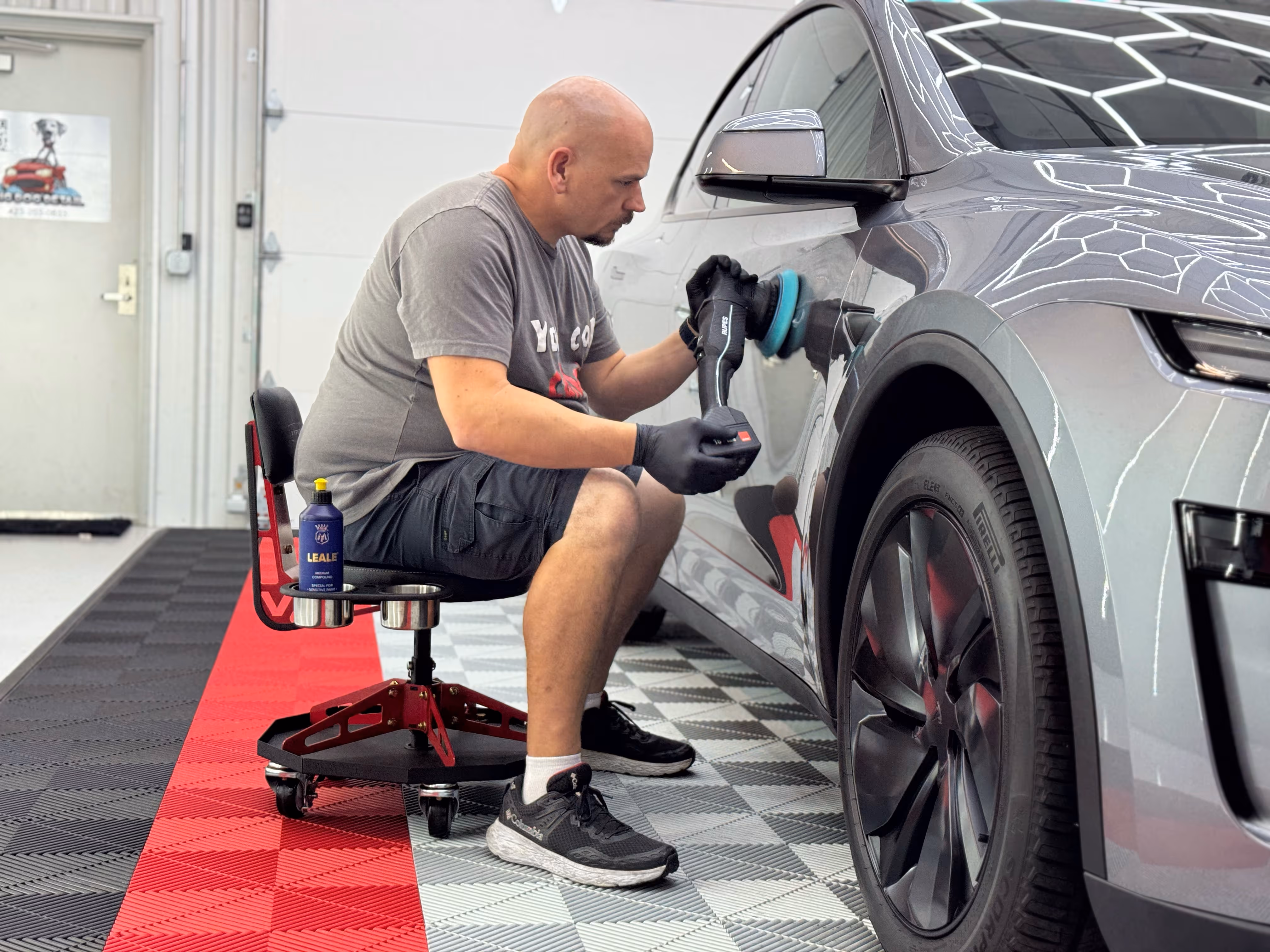 Chattanooga Auto Film Pros co-owner Wayne Woodman, polishing a vehicle in his Chattanooga shop for the ceramic coating application