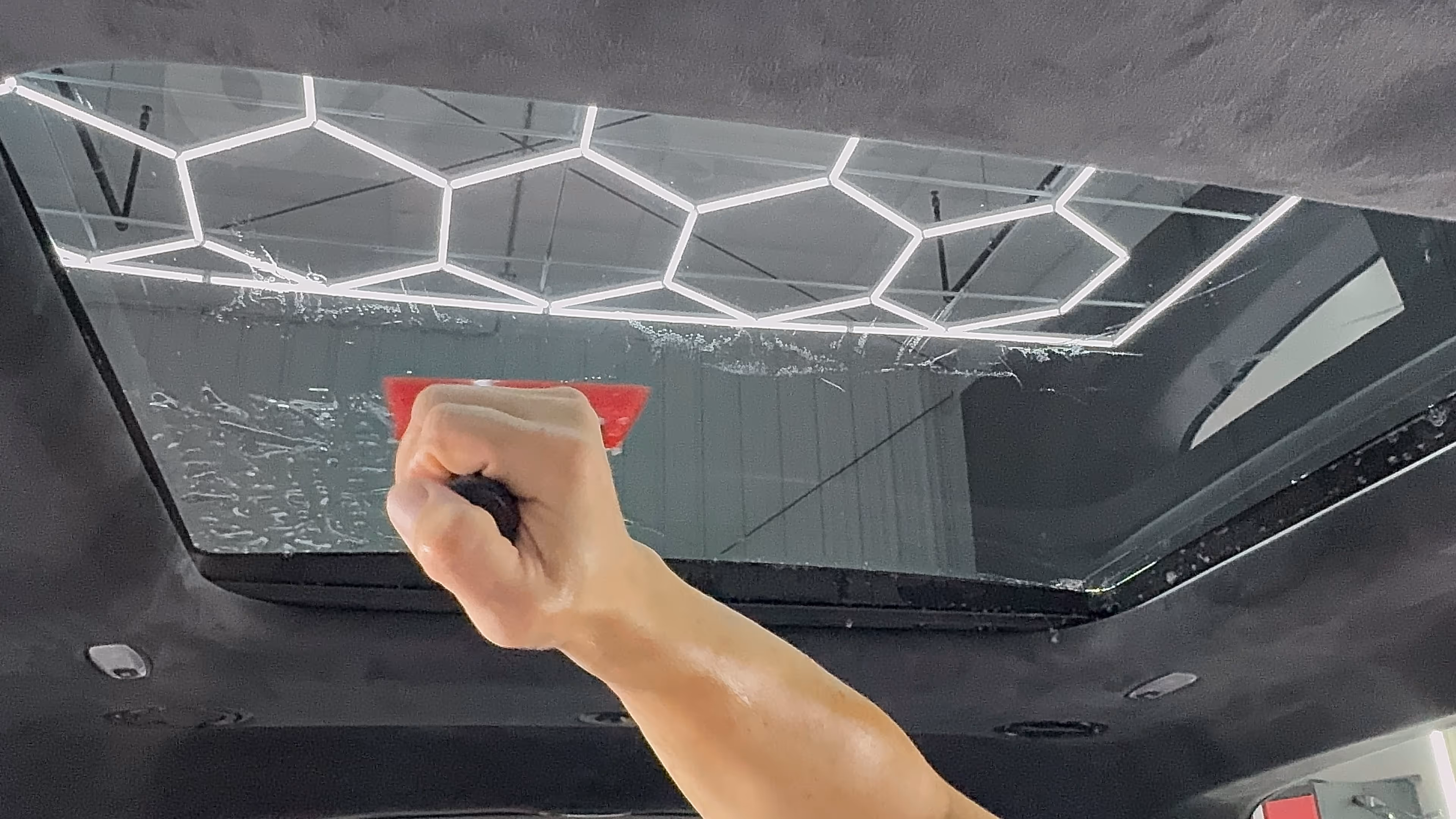 Applying window tint to a car in Chattanooga