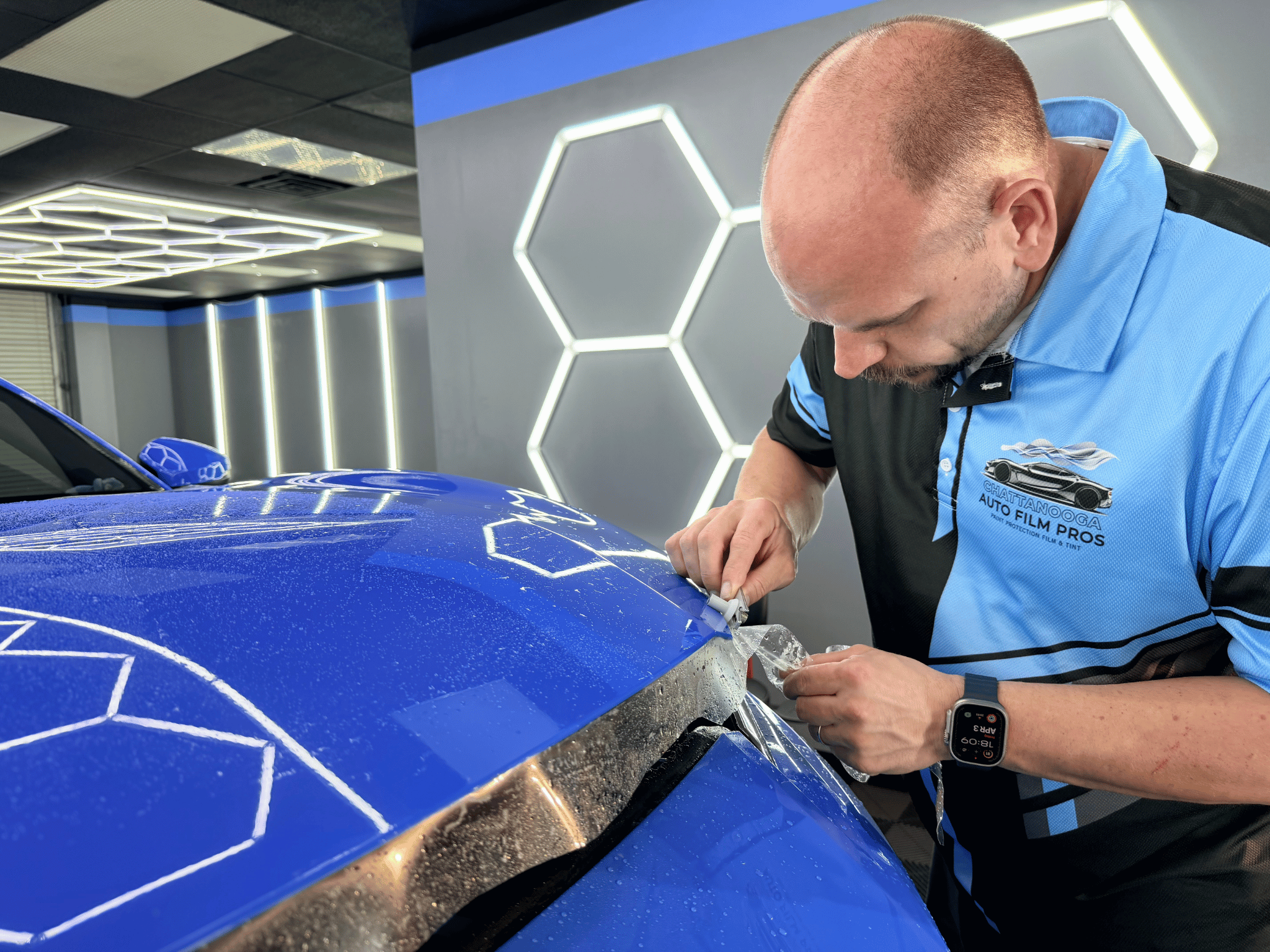 Wayne trimming paint protection film on sports car Chattanooga TN