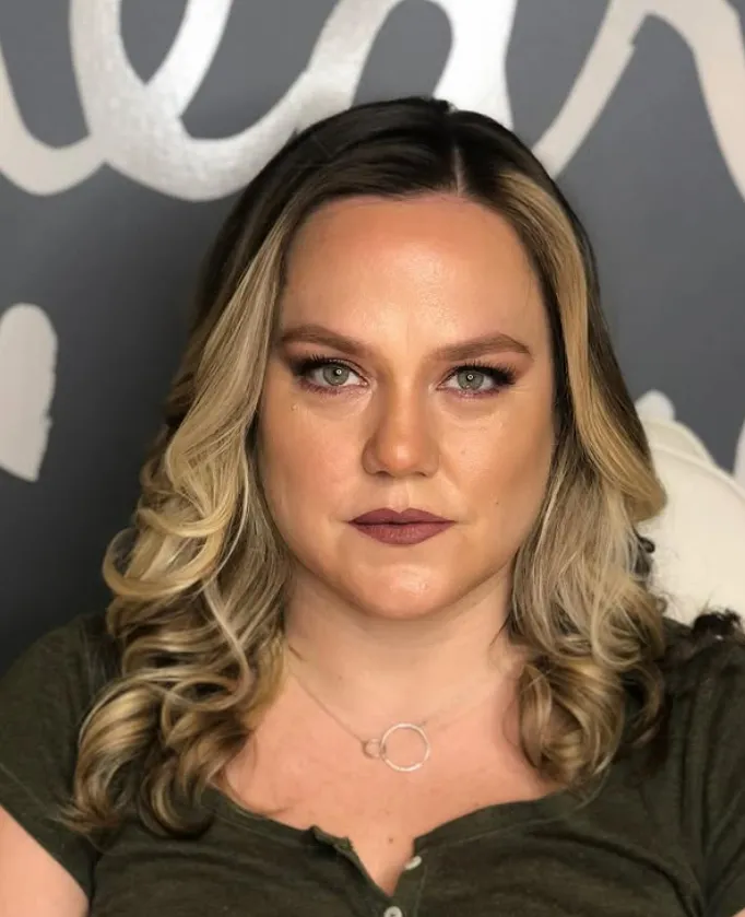 Example of a beauty treatment by Bloomshaus salon, featuring a professional stylist preparing for client service.