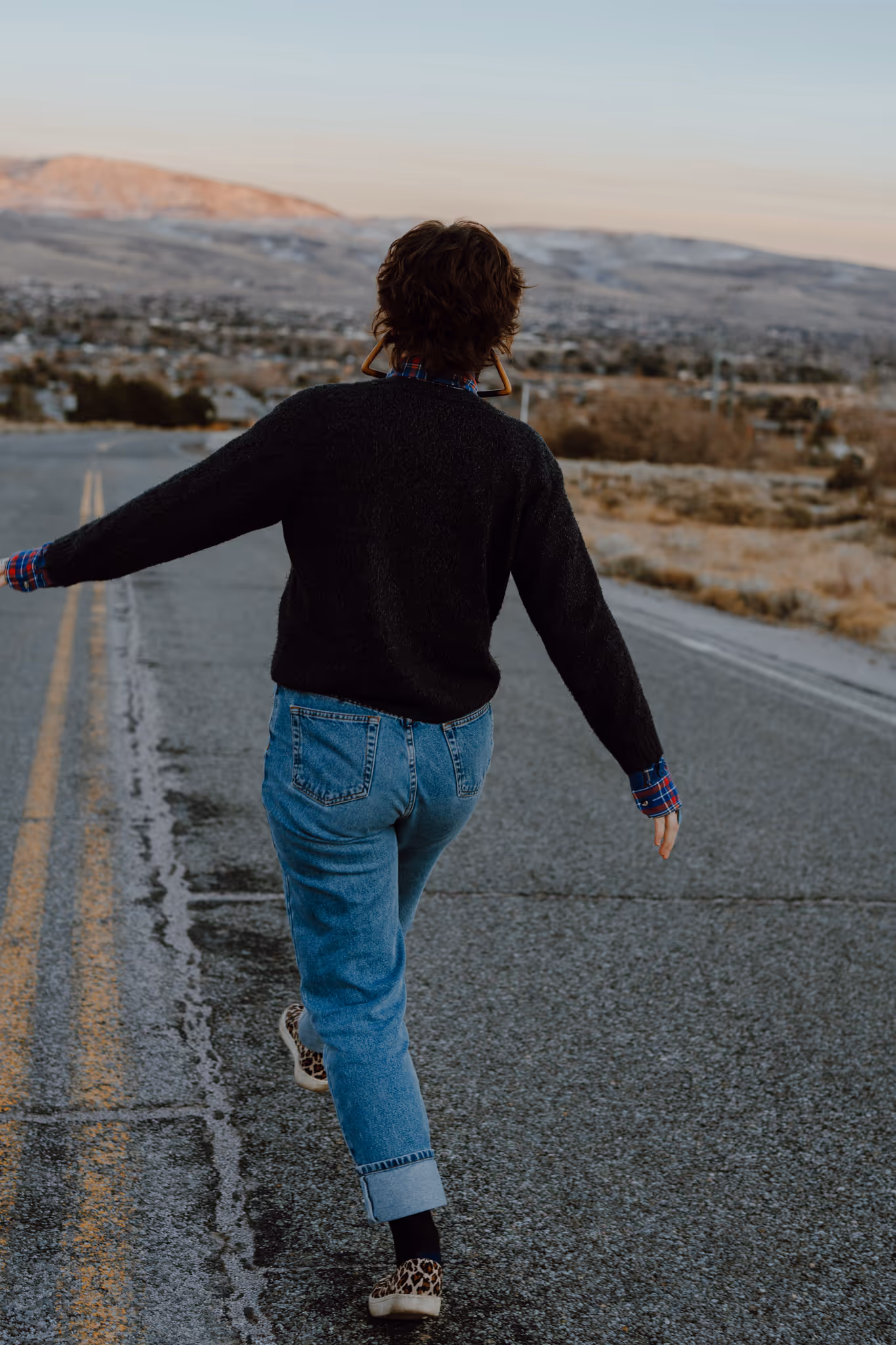Photo of Rachael walking down the road swinging her arms