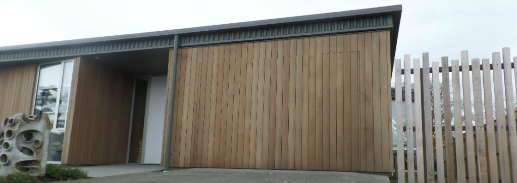 Turn your garage door into a part of your feature wall with a flush mount finish