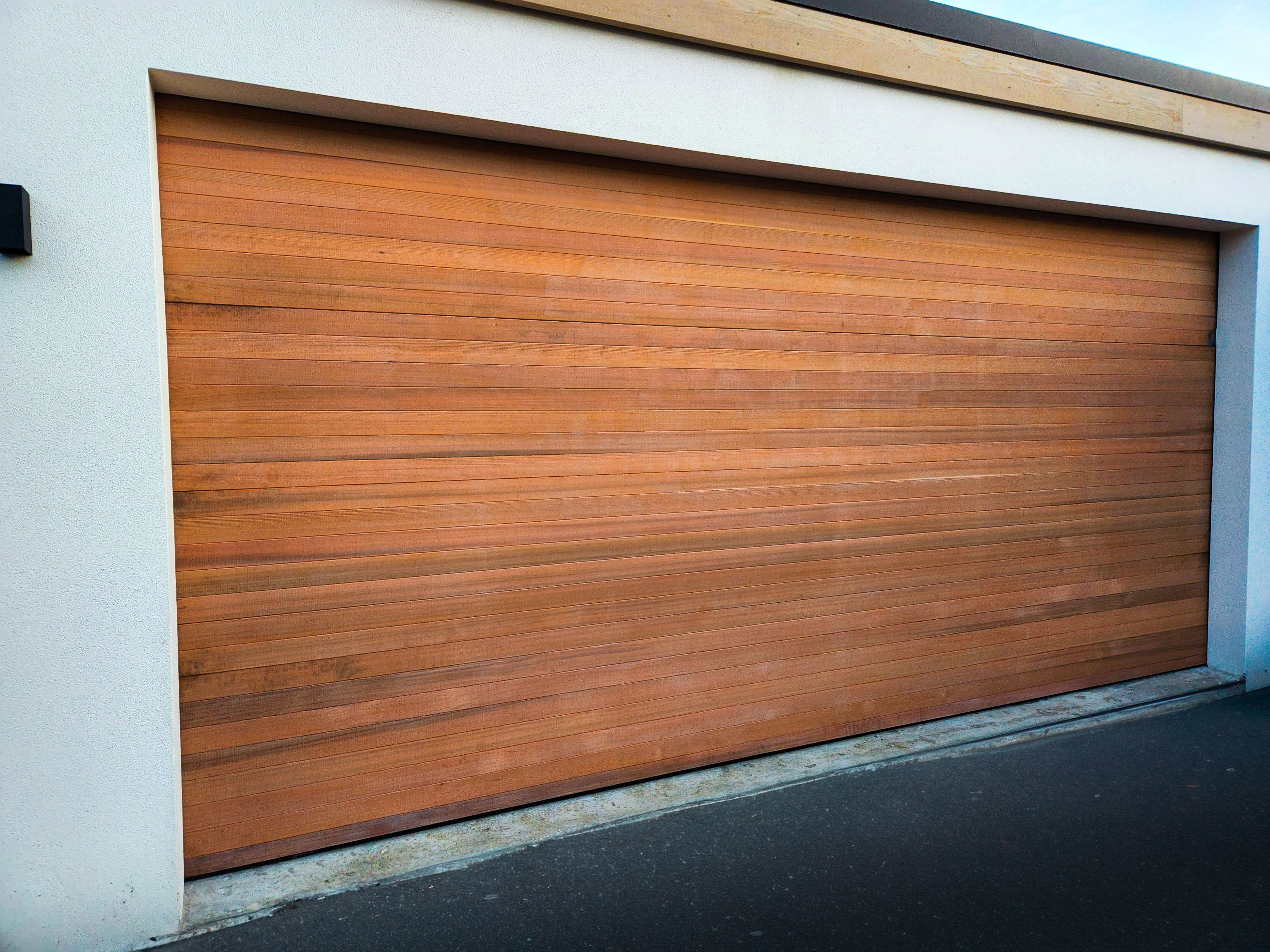 Cedar clad sectional door TG&V