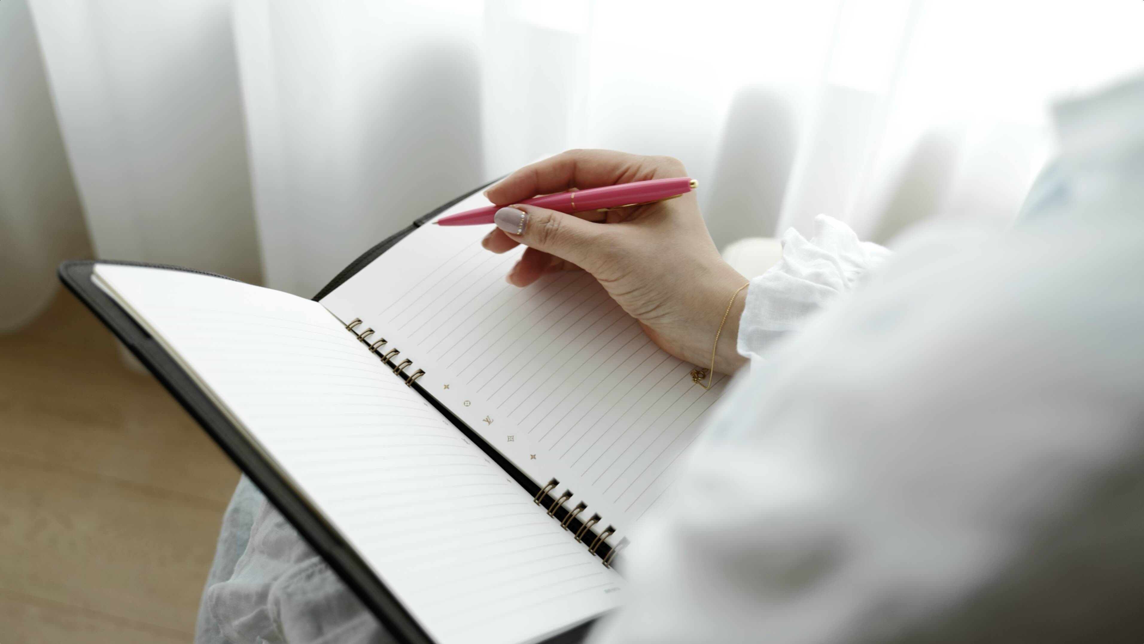 Two women in professional attire, illustrating the concept of following fashion trends for 2025.