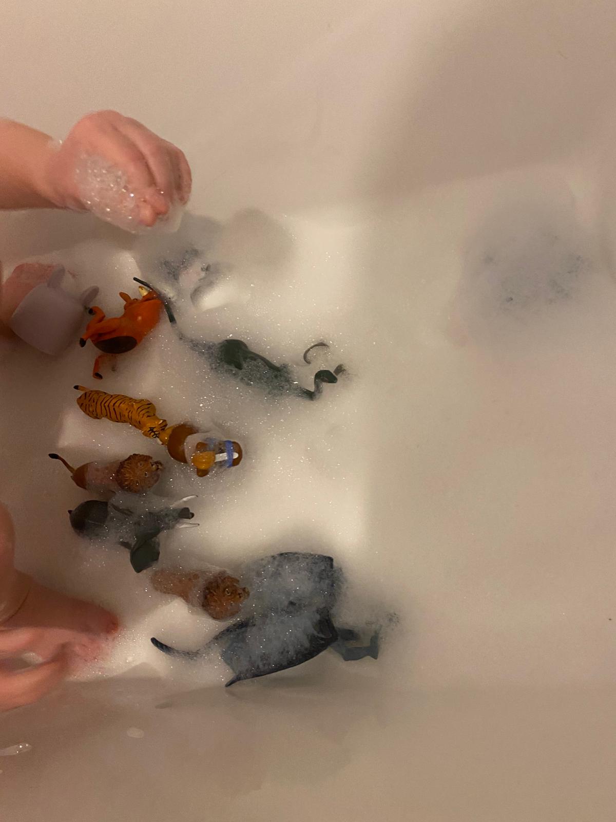 Playing bathtime bubbles in the bath