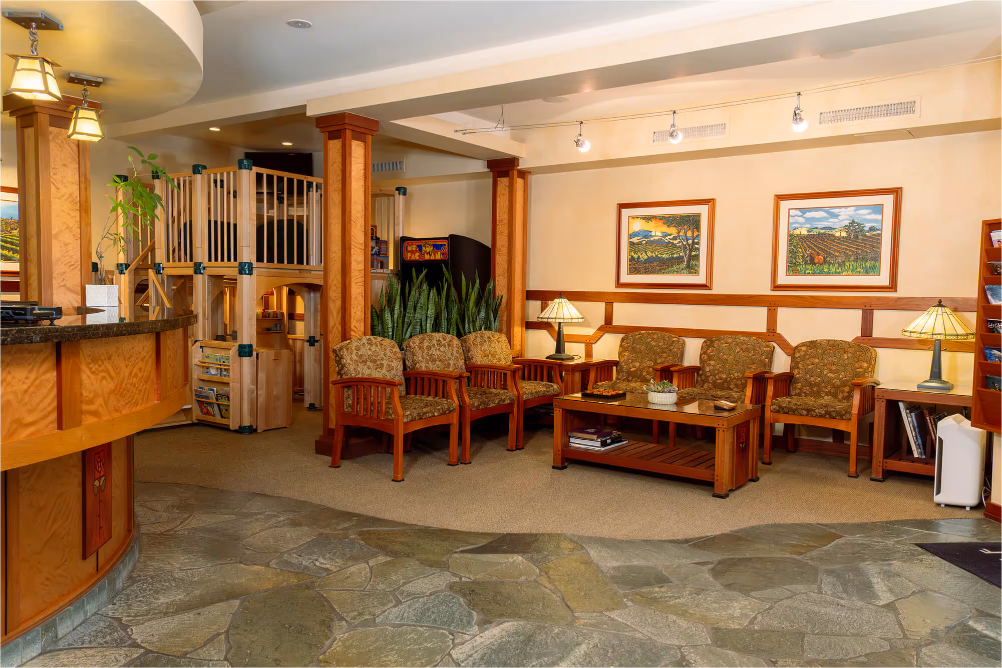 A living room filled with furniture and a bar.