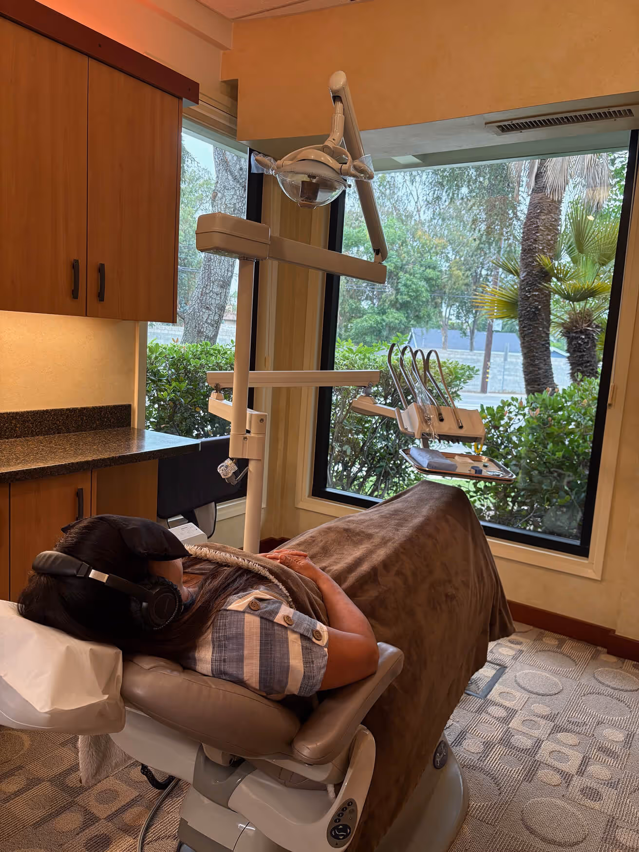 A woman laying on a bed in a room.