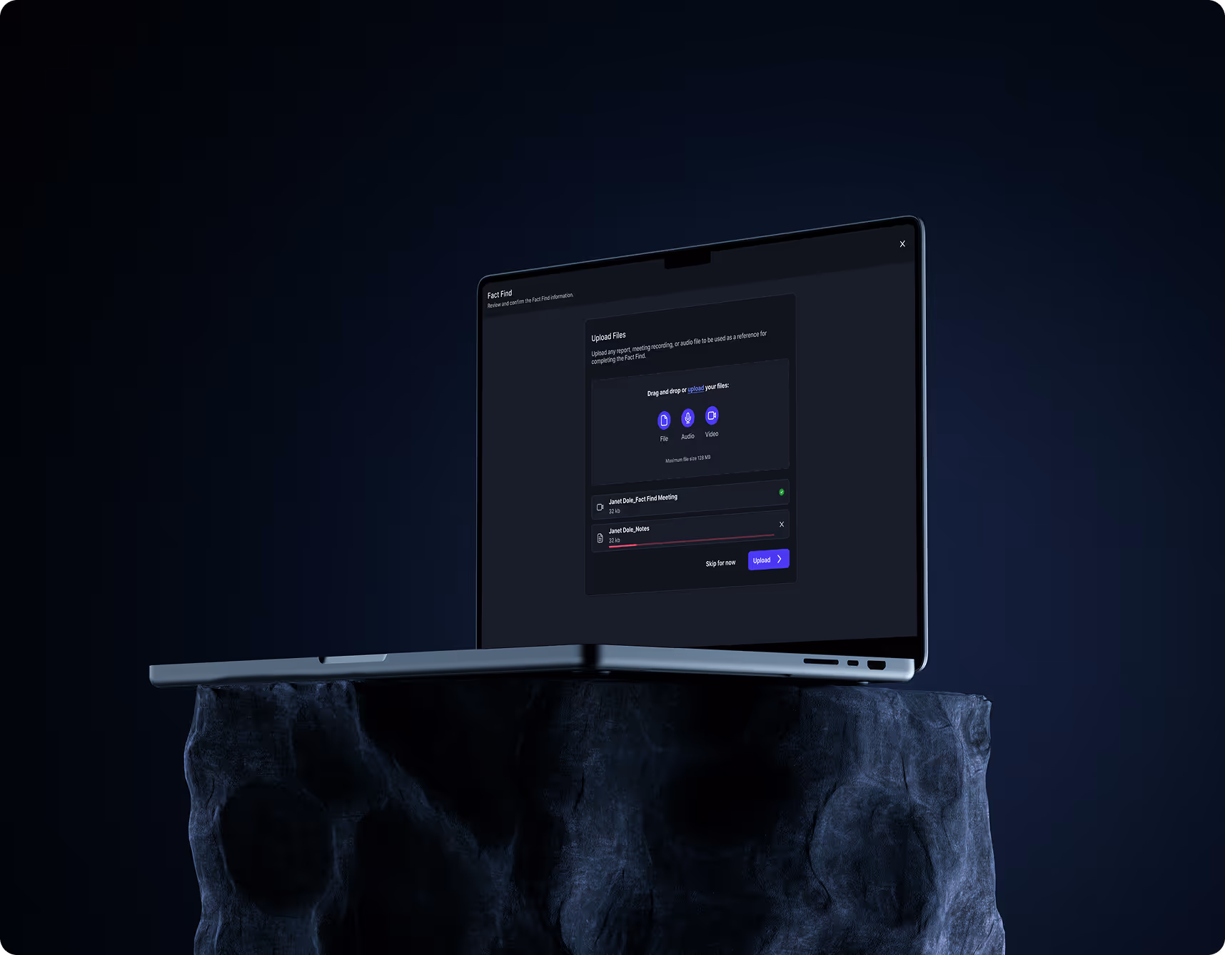 Laptop on a rock showing the AI report generator