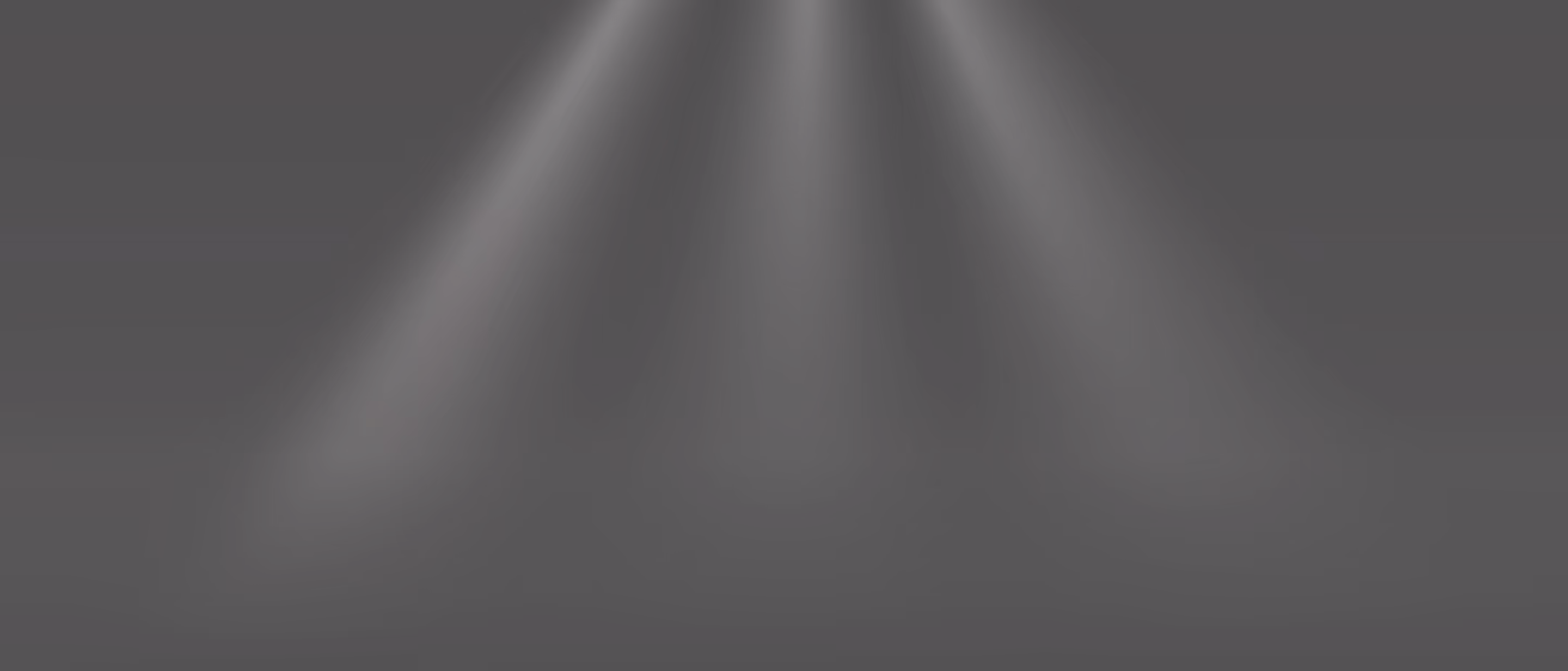 Three soft spotlights shining down against a black background.