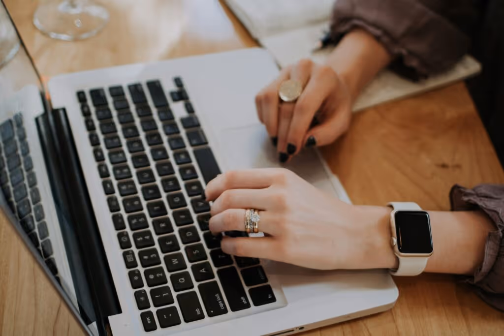 person using macbook to invest in peer-to-peer lending