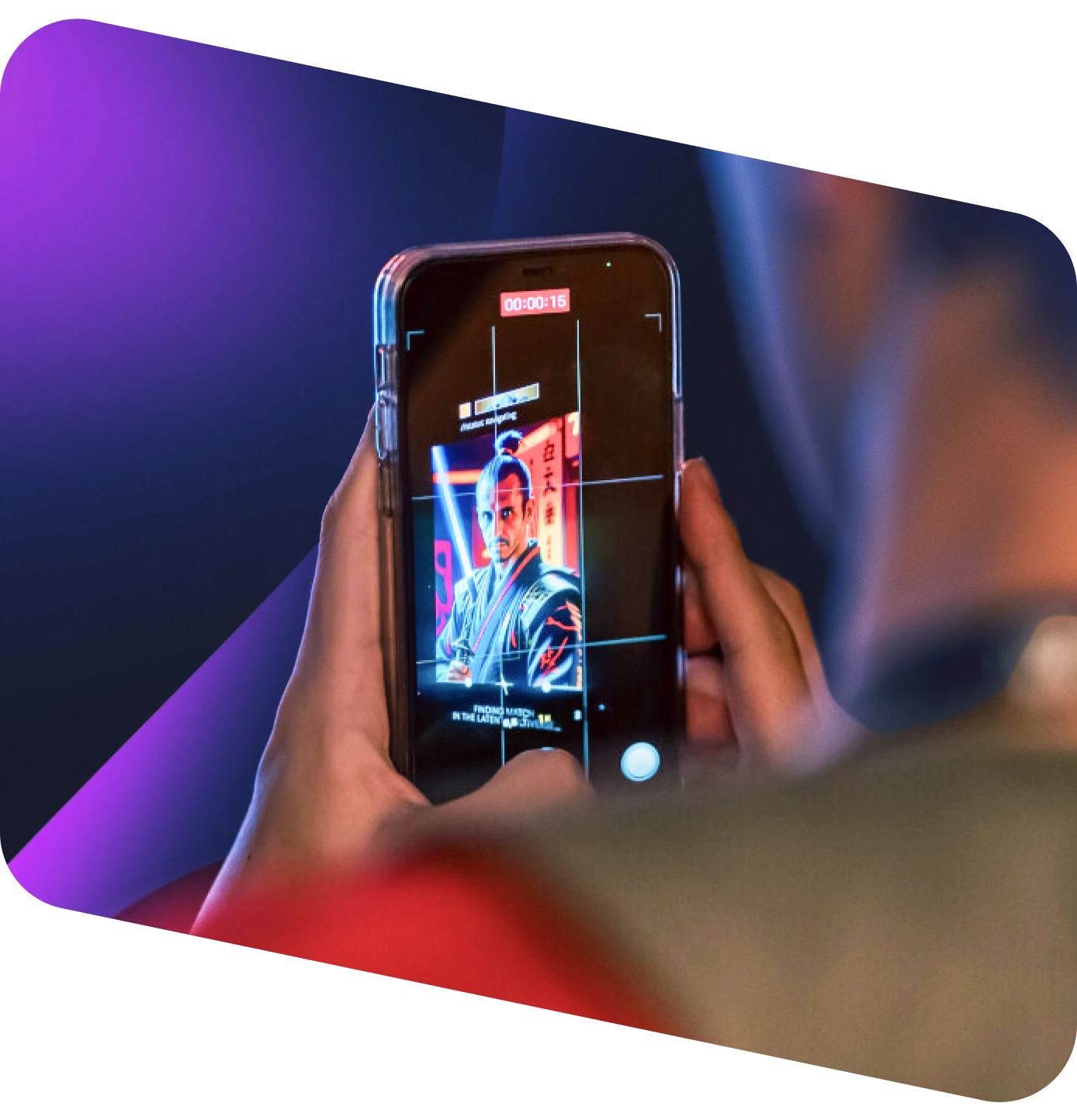 Person taking photo on smartphone of digital billboard