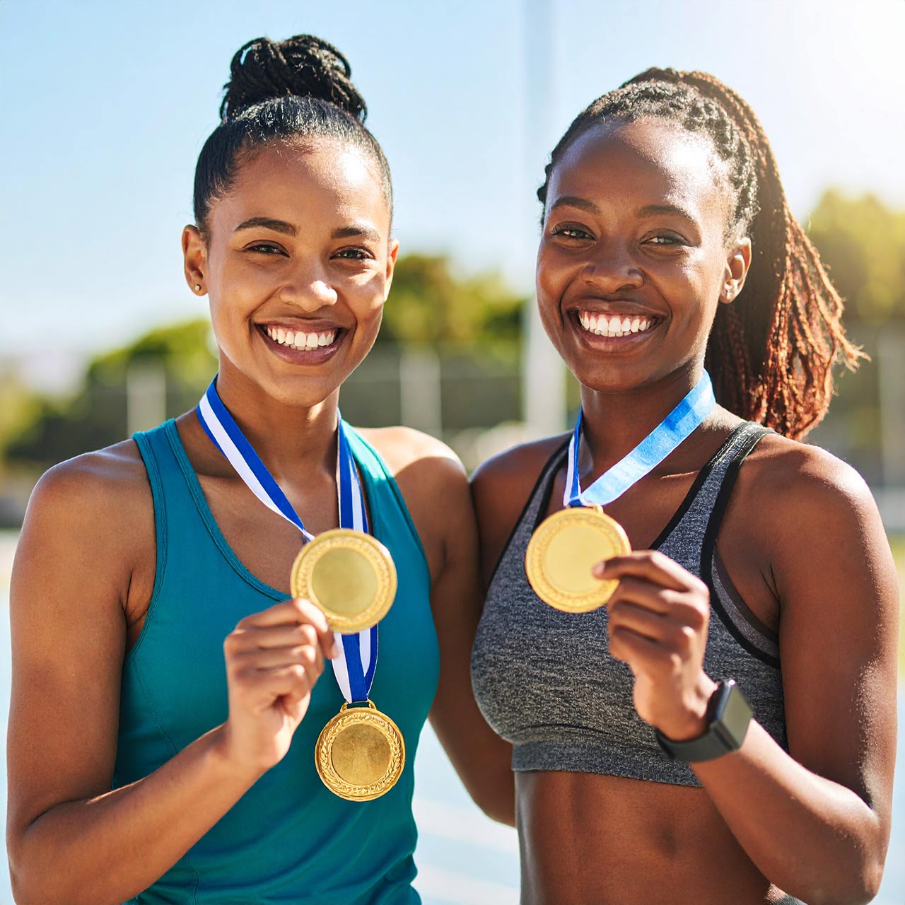 Athletes posing with their gold medals