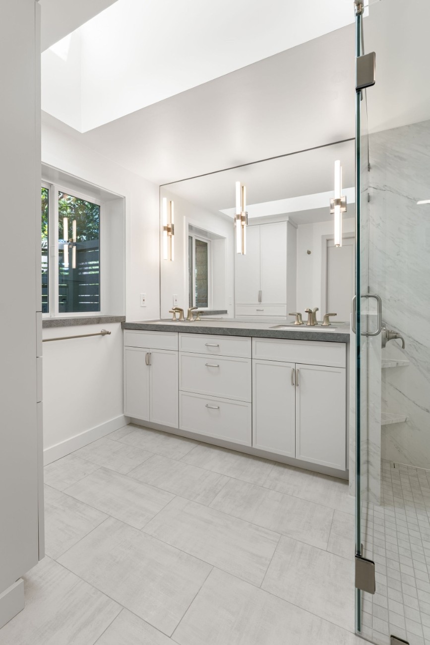 White new bathroom vanity installed during bathroom remodel