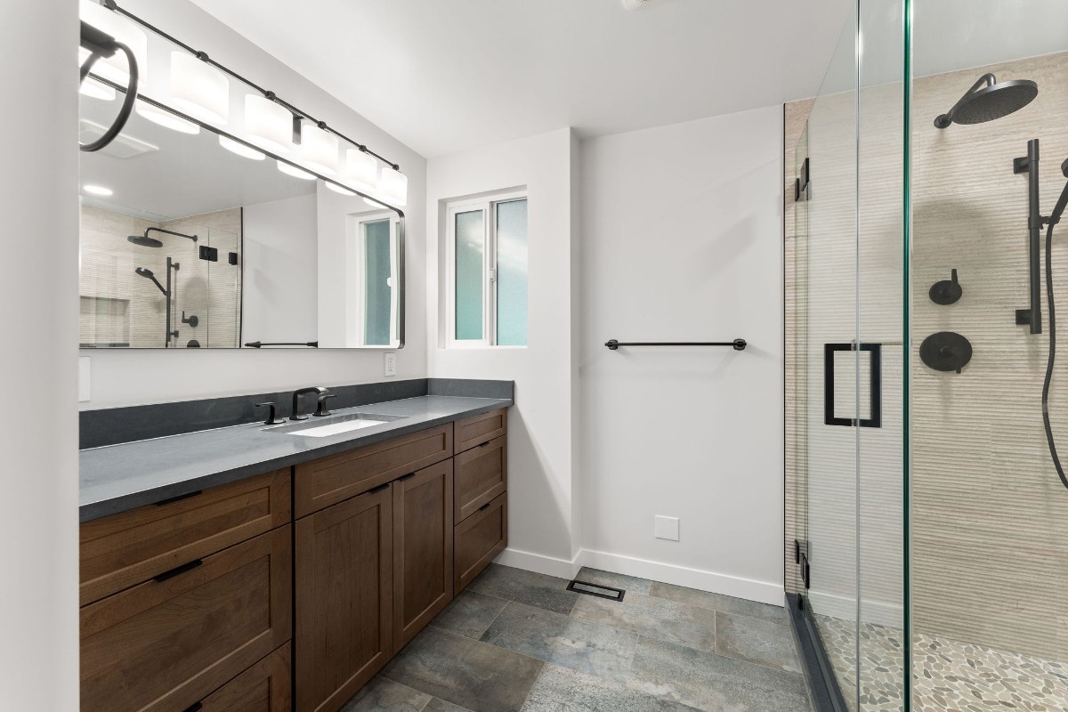New bathroom vanity sink installed in luxury bathroom remodel.