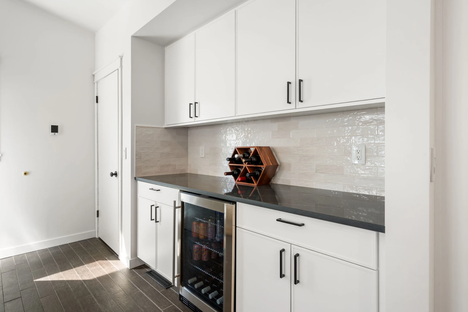 Gas range set between cabinetry with drawers in a remodeled Marysville, WA kitchen.