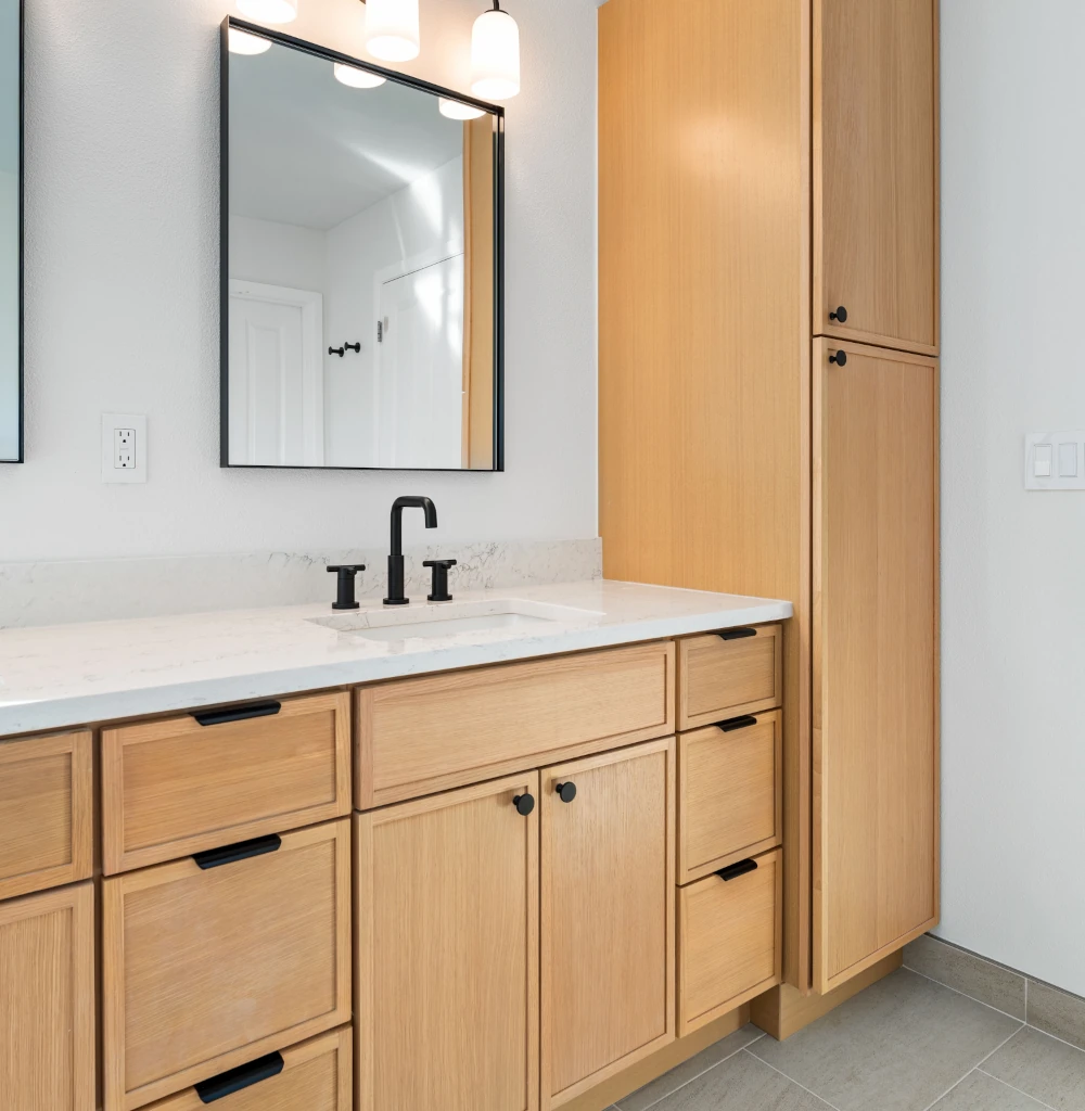 Newly installed bathroom cabinetry under a vanity sink of a home in Magnolia
