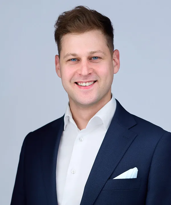 A portrait of Bratłomiej Tokarz, DCX Account Manager