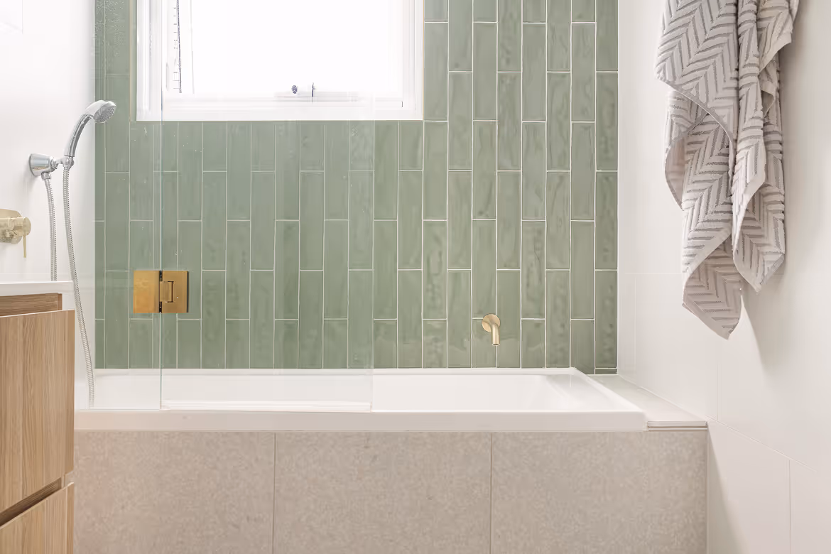 Photo of a bathroom with green tiles