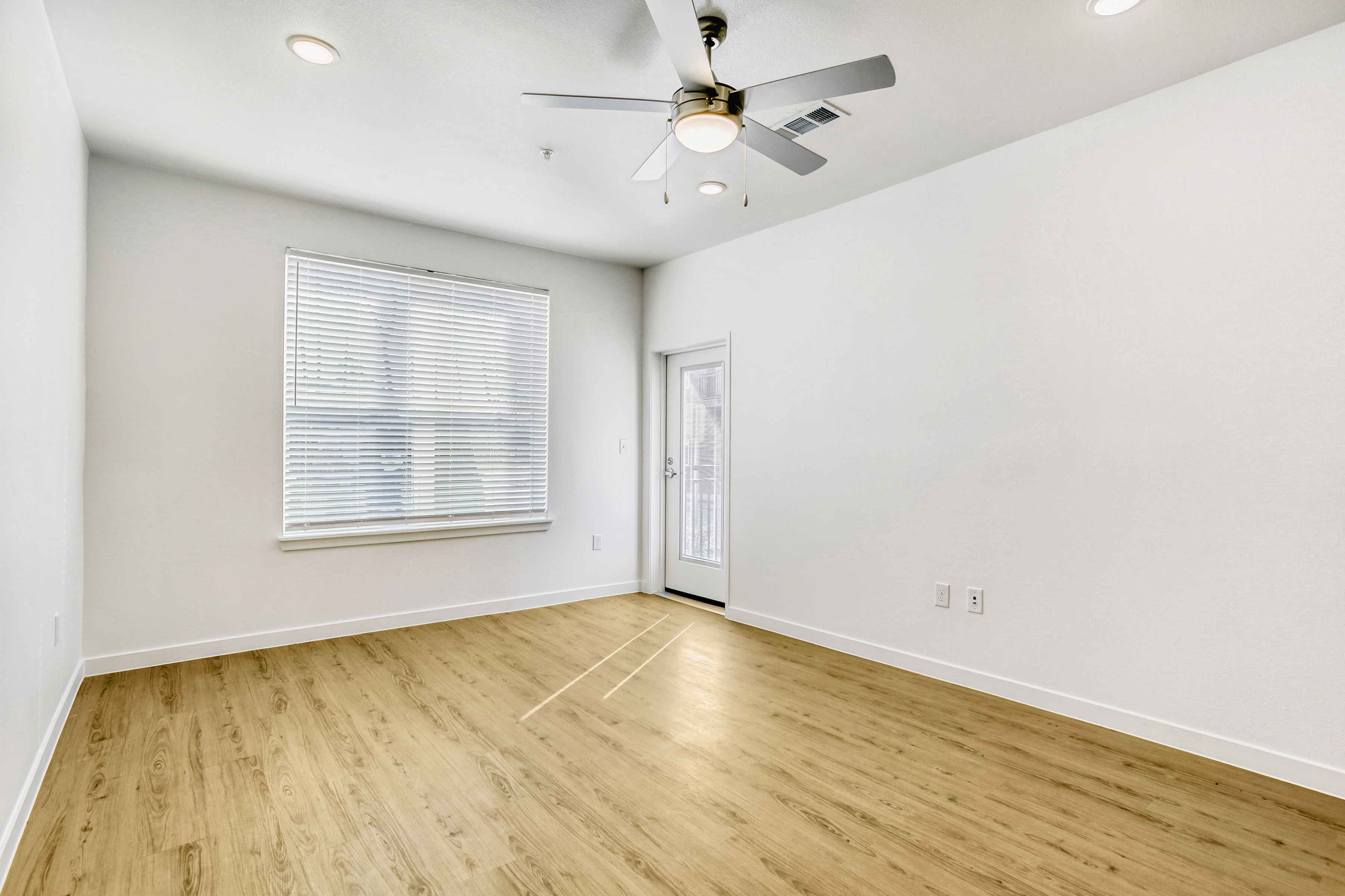 Living room with light brown flooring