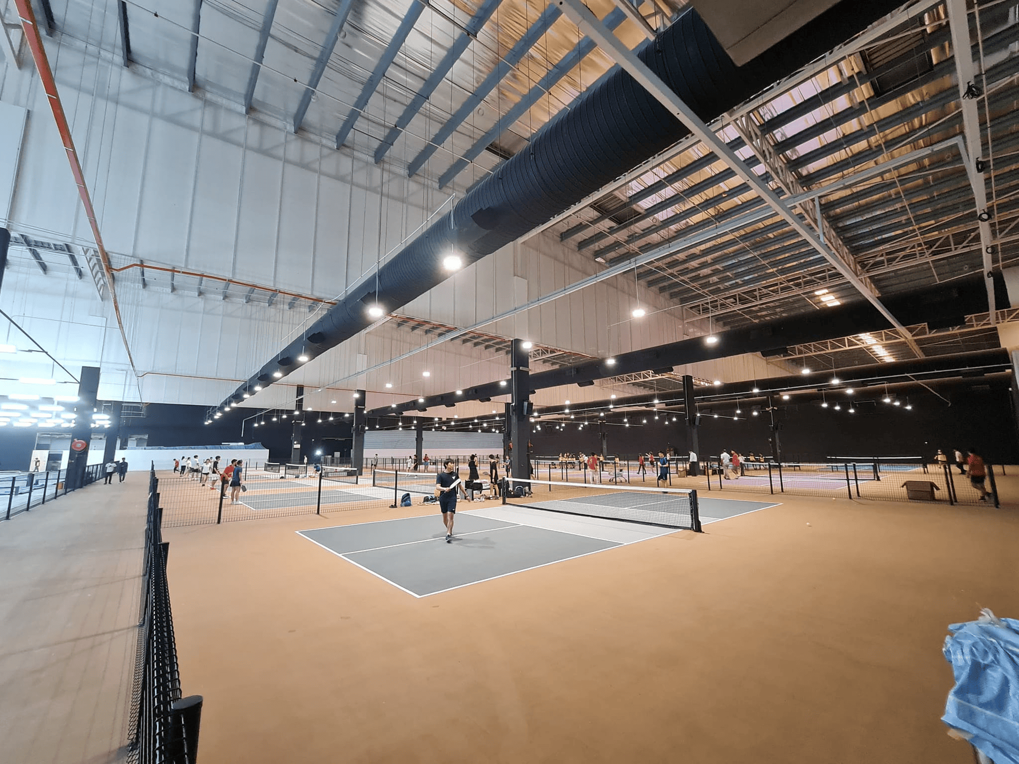 Players enjoying a game of pickleball at Malaysia’s largest indoor pickleball arena - Thumbnail Image
