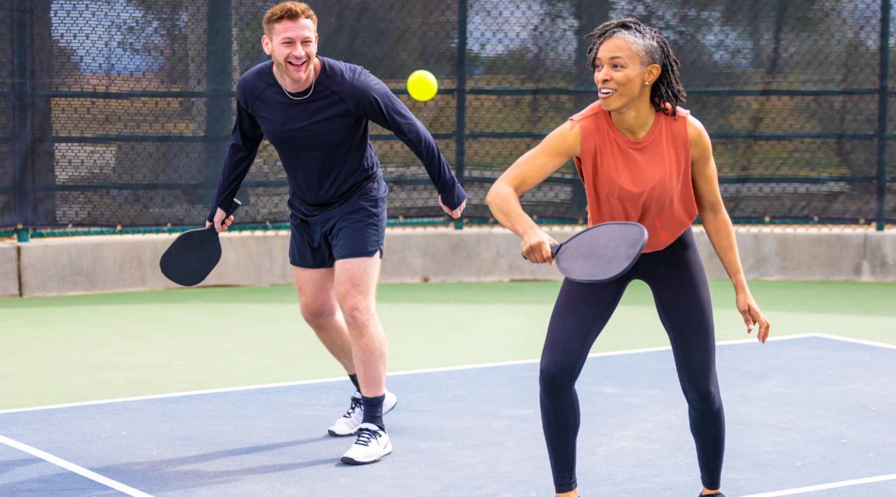 Pickleball team communicating on court using switch and mine calls