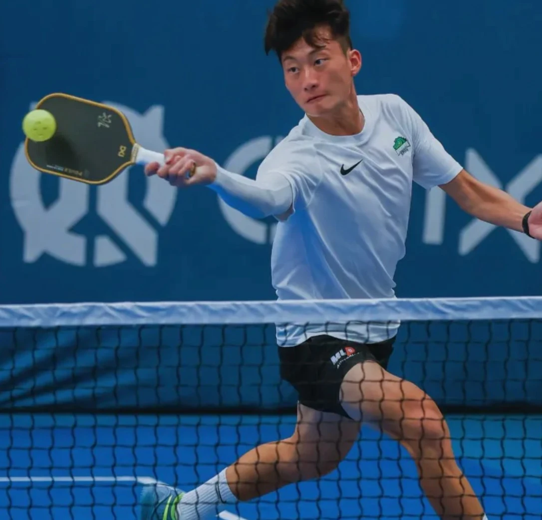 Neilson Chen in action during a competitive pickleball match showcasing athletic form and technique - Thumbnail Image