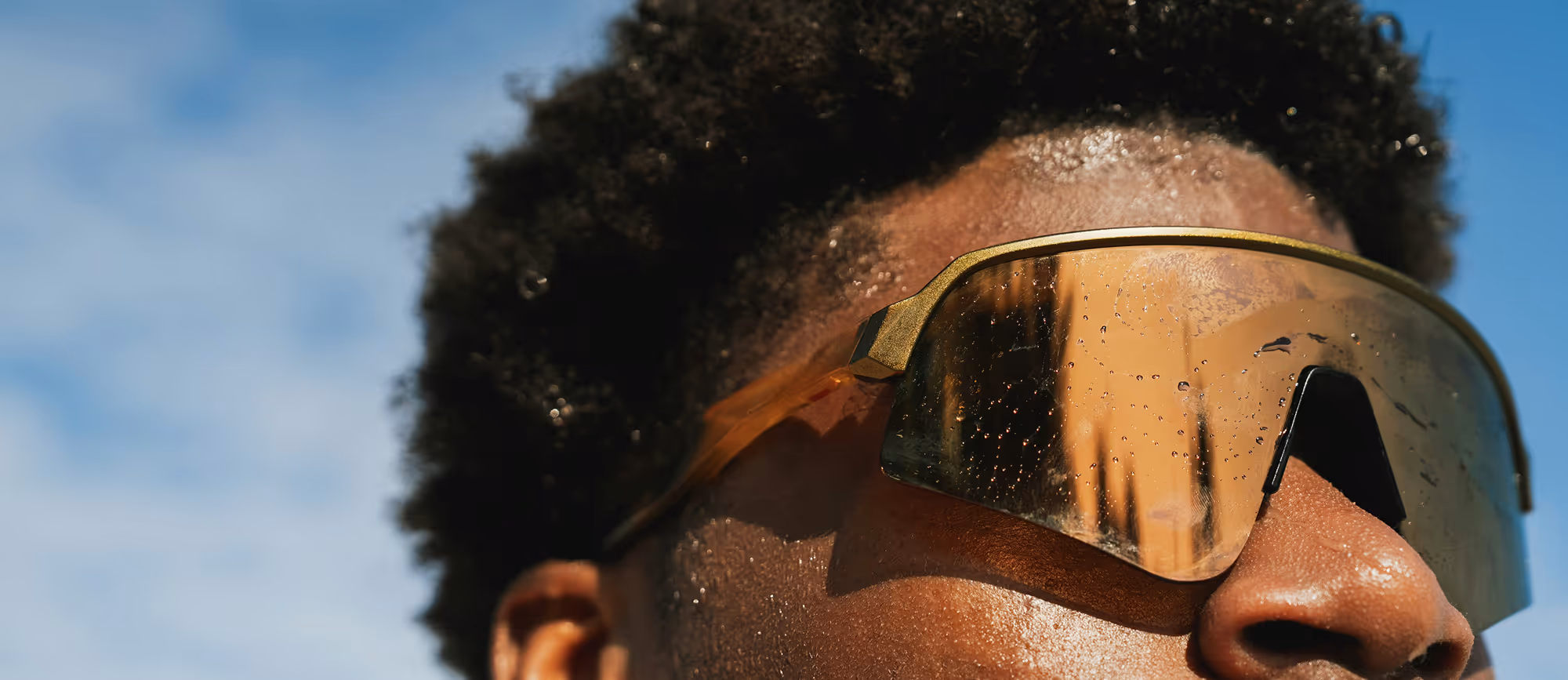 Stylish close-up of dark yellow sunglasses, highlighting modern fashion and premium eyewear design.