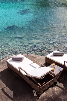 deck chairs looking over the azure bay