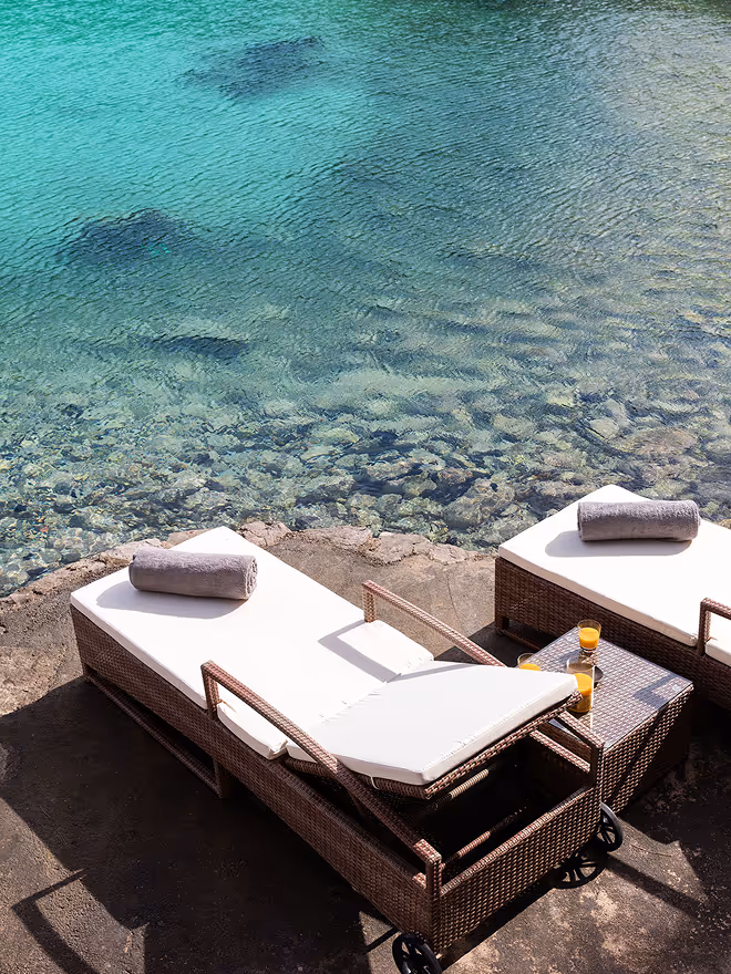 A small sunbed on a rock pier