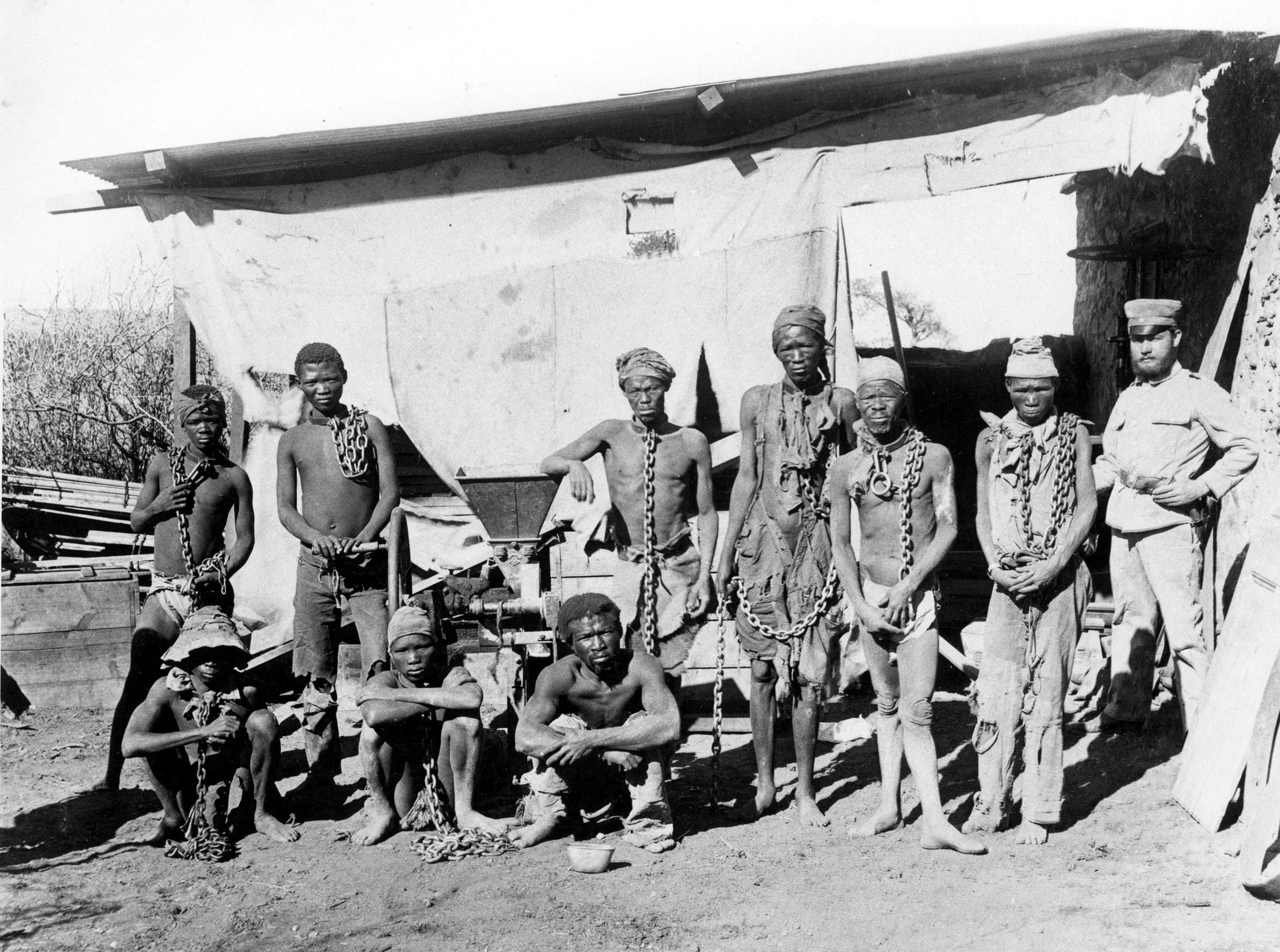 Herero and Nama prisoners in chains during German colonial rule, photograph credited to the National Archives of Namibia