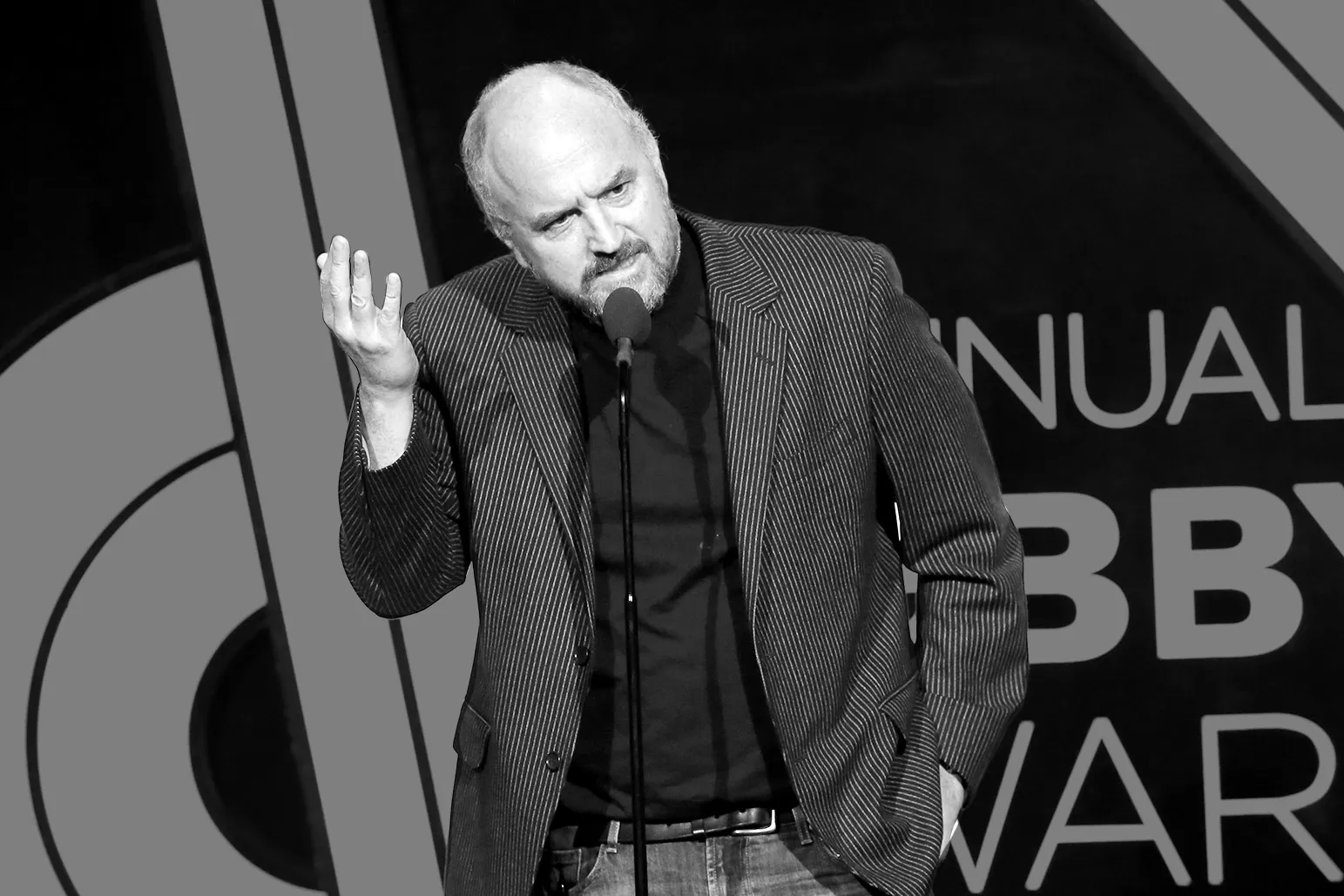 Louis C.K. speaking on stage