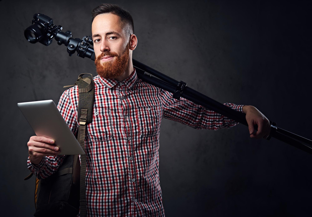 Sound recordist holding a boom microphone