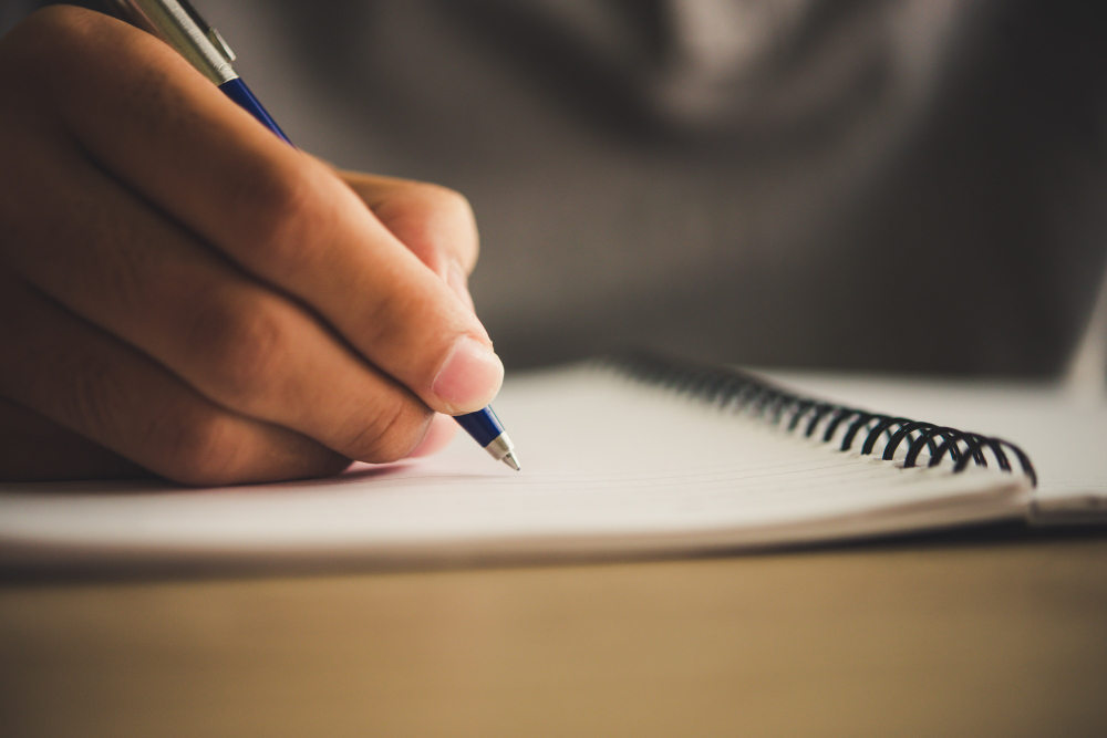 Person writing in a notebook