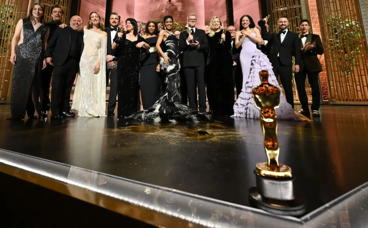 Guests posing on the Academy Awards red carpet
