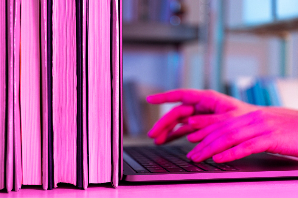 Hands typing at a computer