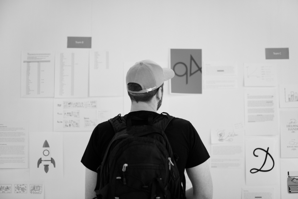 Student viewing a graphic design exhibition